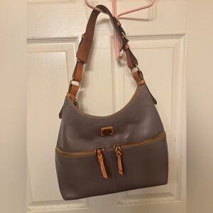 very gently used Dooney & Bourke leather purse. only worn twice